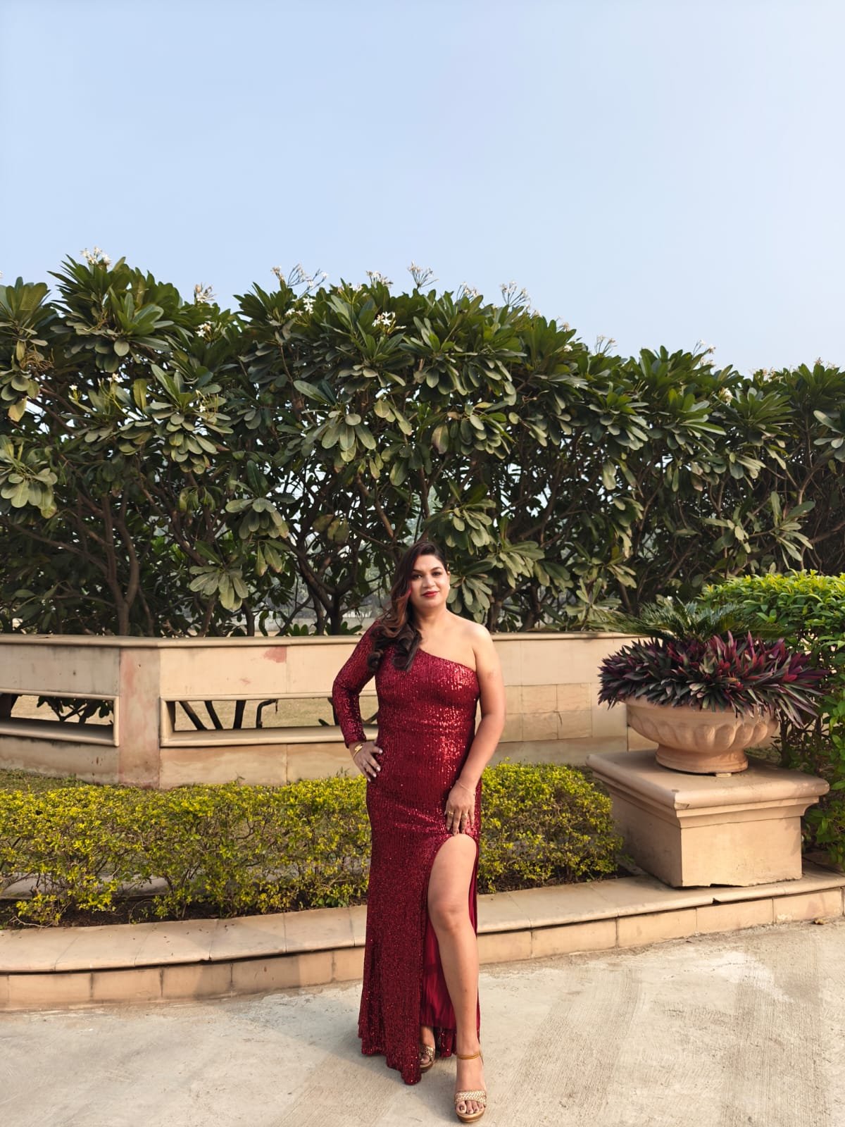 Neelam Roy in stunning red sequin one-shoulder gown at garden venue
